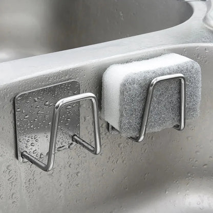 Porte-éponge pour évier en inox avec une éponge